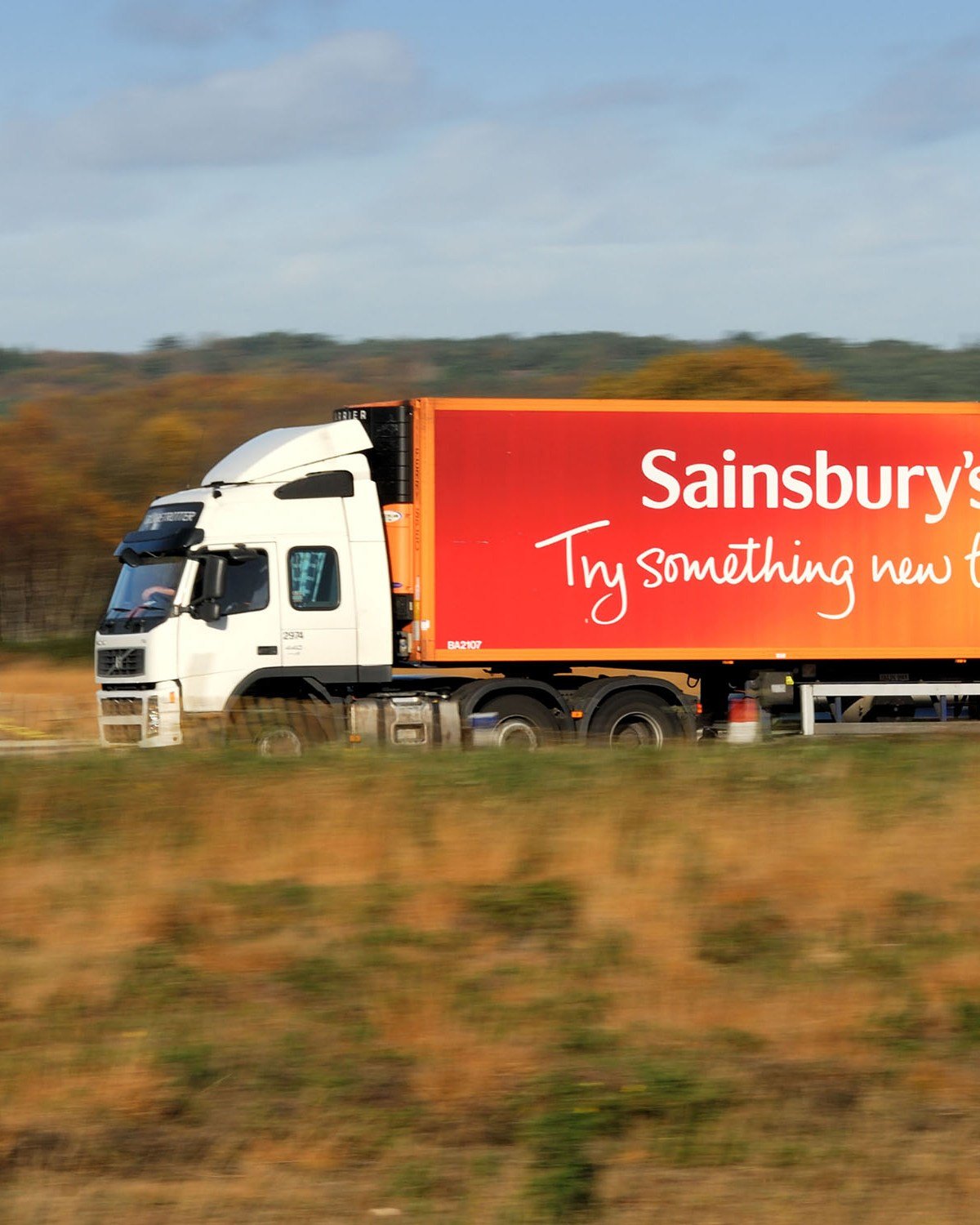 lgv recruitment 1 White and orange Sainsbury's lorry driving on a UK road